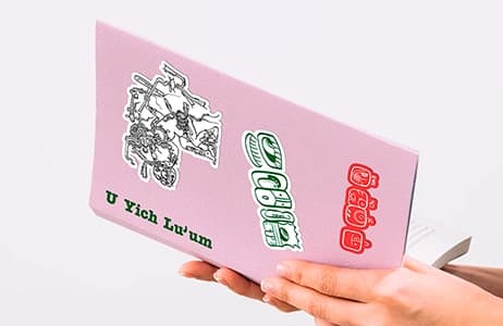 Printed brochure with a folded pink cover, designed for partner organization U Yich Lu'um.